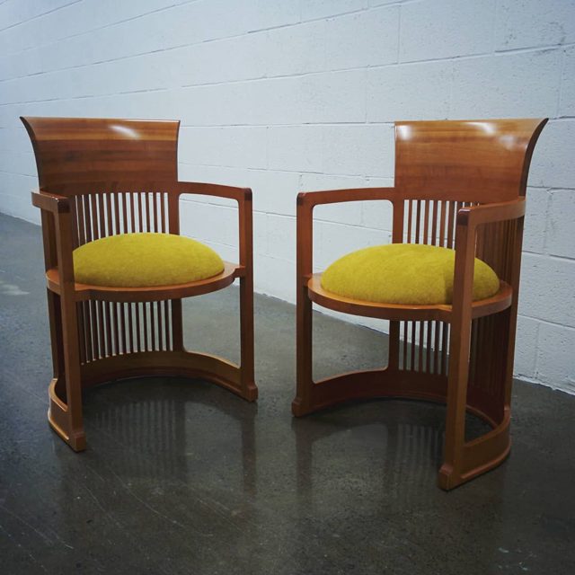 A pair of Frank Lloyd Wright barrel chairs, designed in 1937 and made in 1986 by Cassina.  Recovered by Flyss in 2020 wi