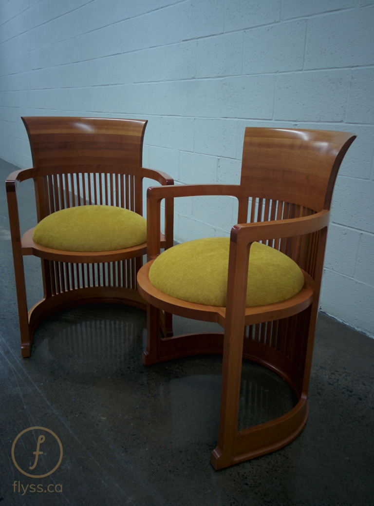 Two Frank Lloyd Wright barrel chairs reupholstered with mustard yellow seats